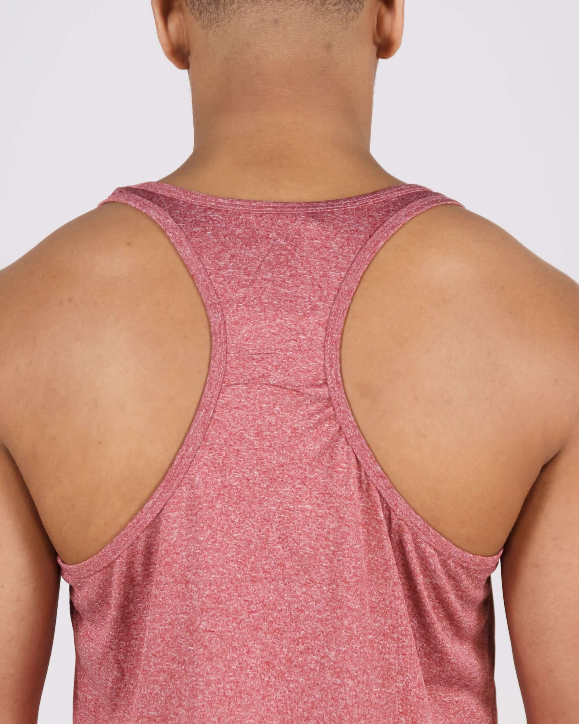 Back view of person wearing pastel maroon Pinnacle Slim Fit Tank Top showcasing racerback design and premium material.