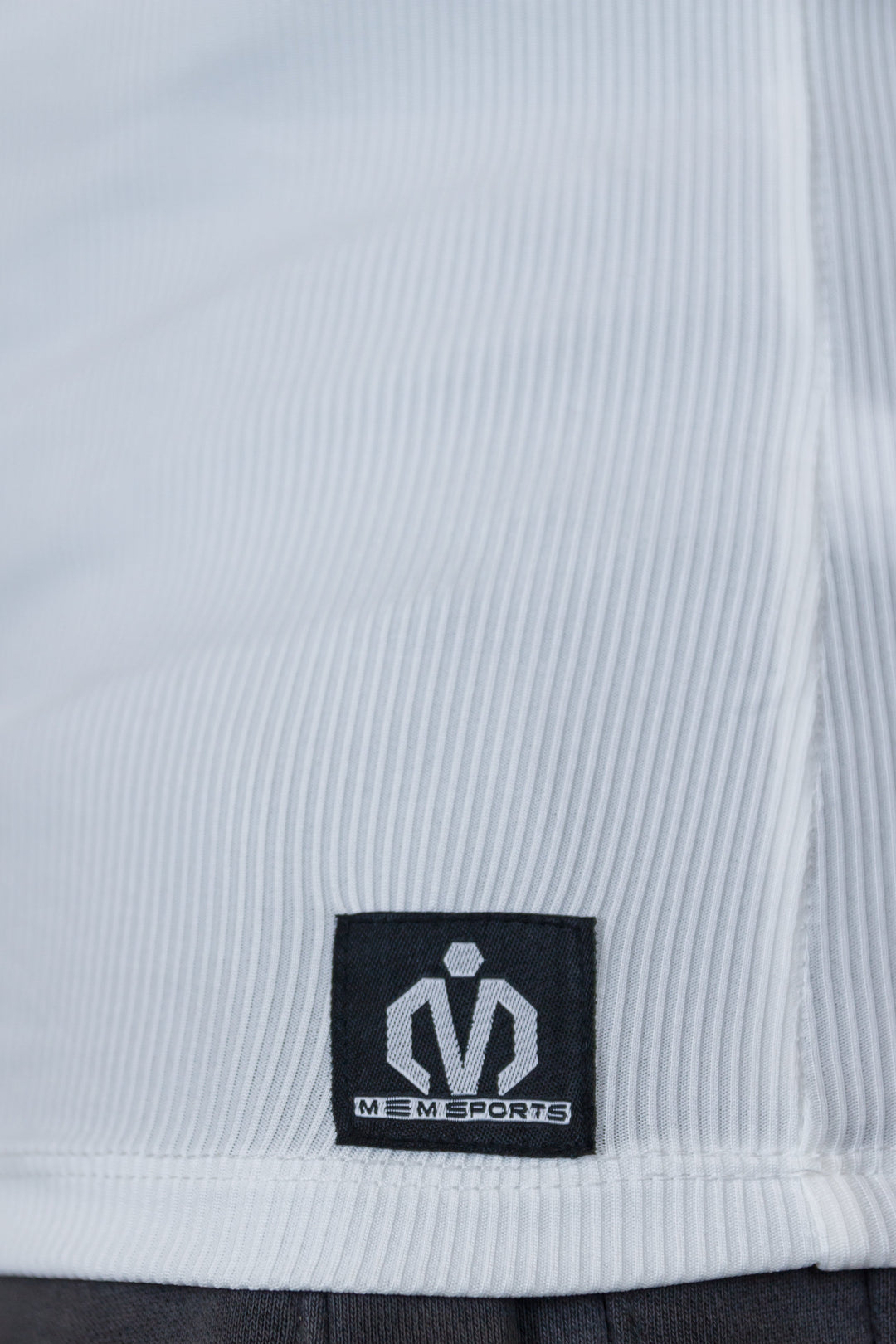 Close-up of a label on a piece of clothing with a brand logo.