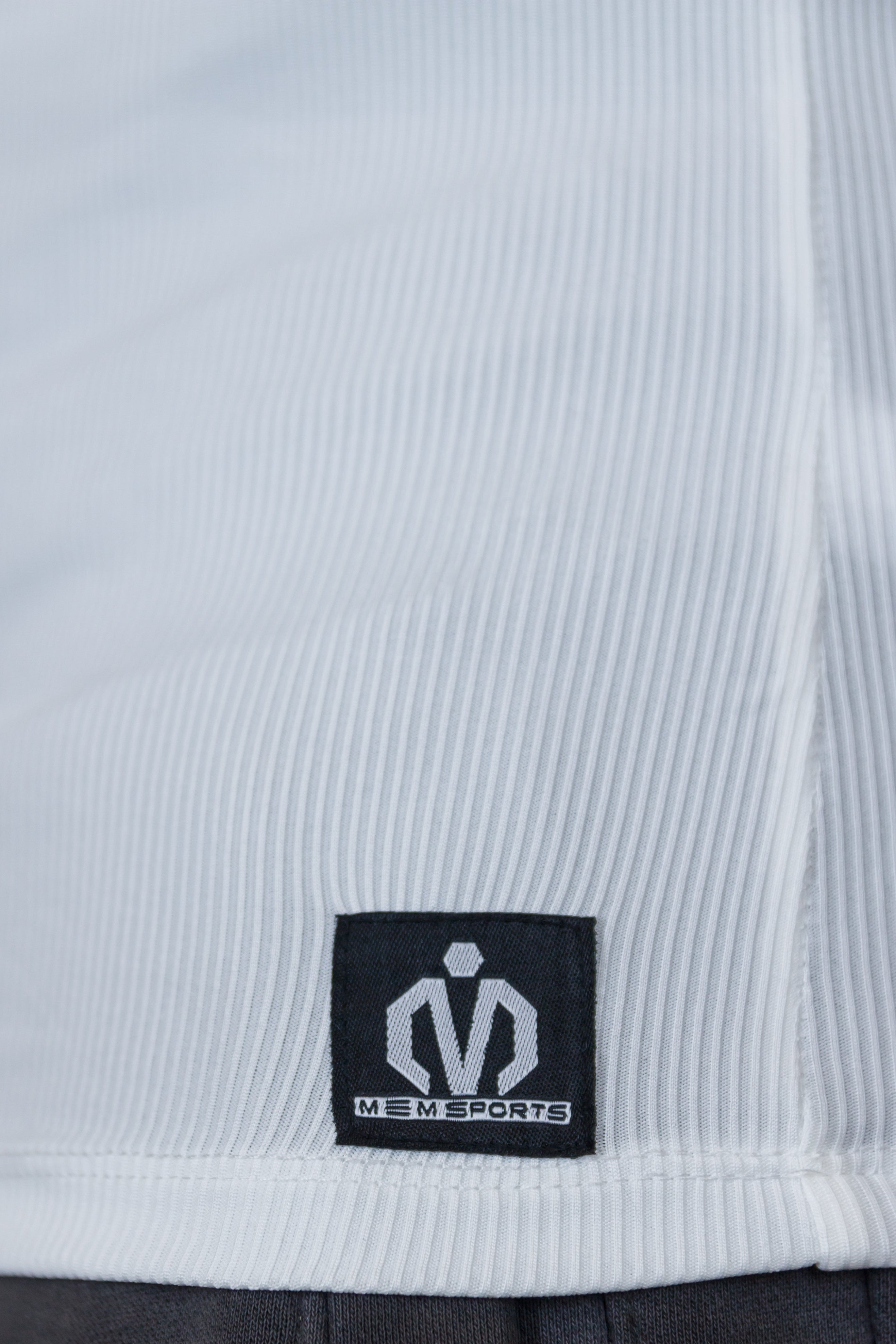 Close-up of a label on a piece of clothing with a brand logo.